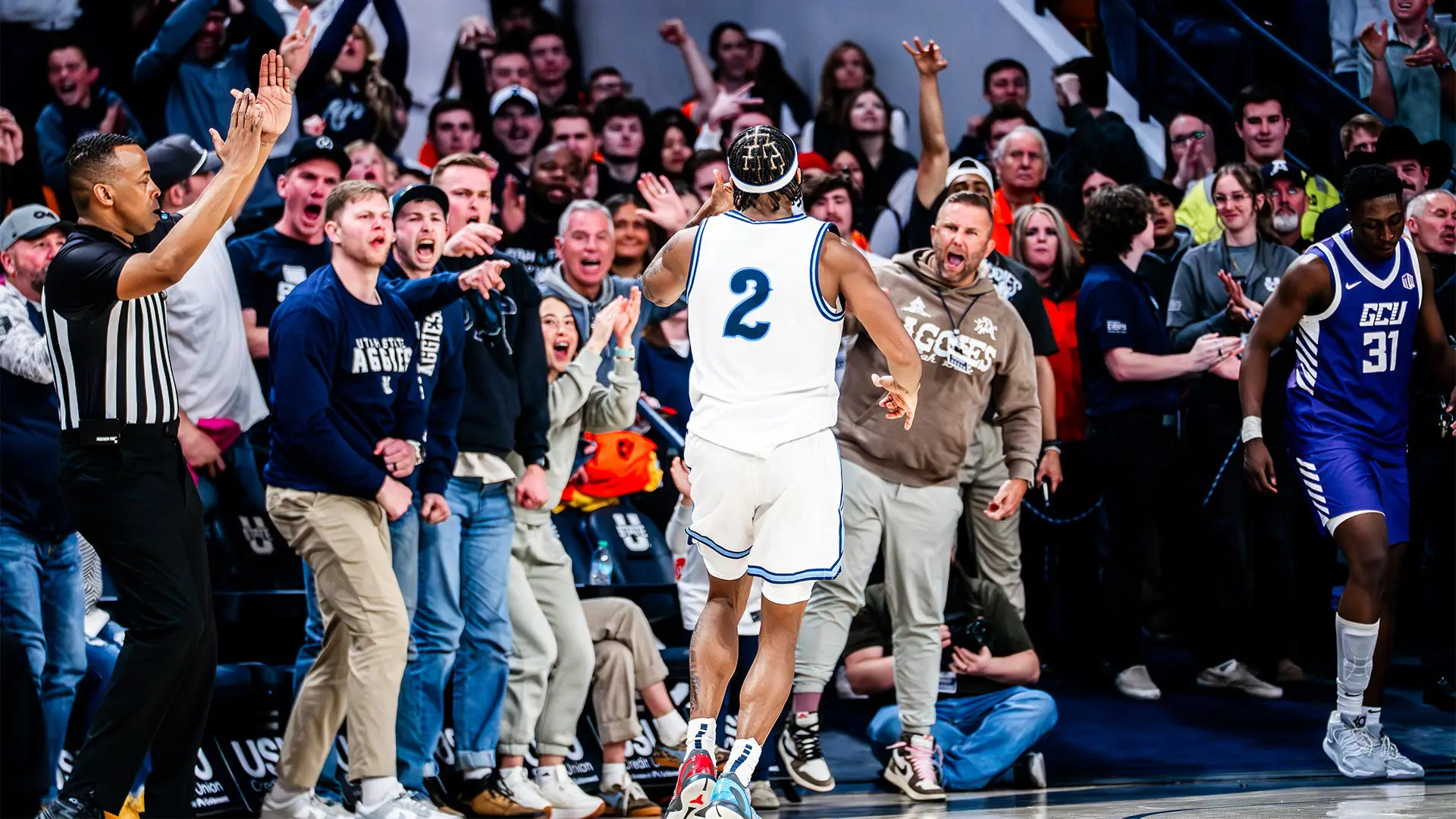 Fans celebrating with player after big three